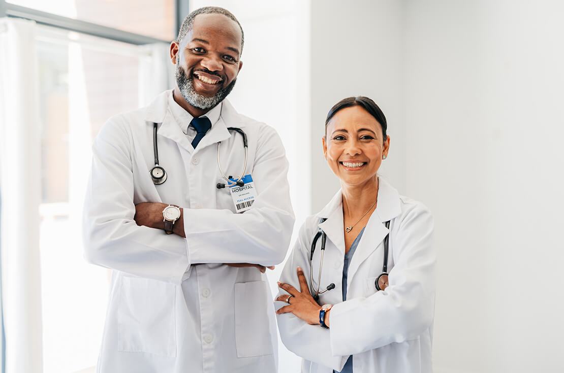 Doctor, healthcare and medical man and woman with smile